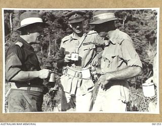 KUMBARUM, NEW GUINEA. 1943-11-14. MAJOR GENERAL J. S. LETHBRIDGE, CBE, MC, (LEFT); VX9 MAJOR GENERAL G. A. VASEY, CB, CBE, DSO, GENERAL OFFICER COMMANDING 7TH AUSTRALIAN DIVISION (CENTRE) AND NX3 ..