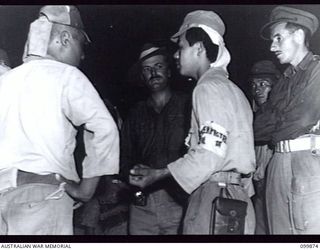 RABAUL, NEW BRITAIN, 1946-03-01. AFTER A LONG PERIOD OF HEAT, SELF COMBUSTION OF CORDITE CAUSED A FIRE IN 5,500 TONS OF JAPANESE AMMUNITION AWAITING DUMPING OFF RABAUL. ALL THE AMMUNITION WAS ..