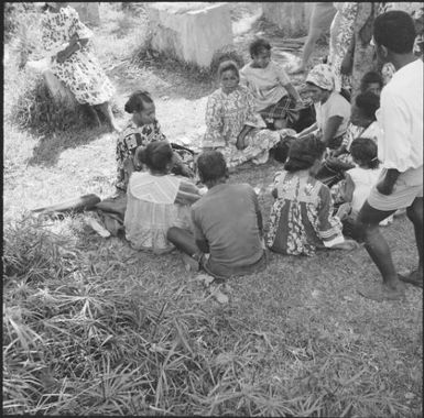 Group of people sitting on the grass, New Caledonia, 1967 / Michael Terry