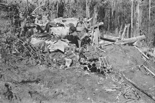 TOROKINA AREA, BOUGAINVILLE ISLAND. 1944-11-29. THE MORTAR DETACHMENT OF C COMPANY, 9TH INFANTRY BATTALION, FIRING IN SUPPORT OF THE D COMPANY ATTACK ON LITTLE GEORGE HILL. IDENTIFIED PERSONNEL ..