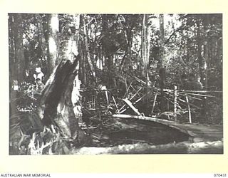 WEBER POINT, NEW GUINEA, 1944-02-14. VX117169 CHAPLAIN F.J. MCKENNA, (ROMAN CATHOLIC), CONDUCTS REQUIEM MASS AT 8TH INFANTRY BRIGADE HEADQUARTERS, FOR WX36148 WARRANT OFFICER II, J.A. KEHOE, 30TH ..