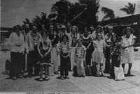 Group of 19 people wearing leis, photo labeled Honolulu