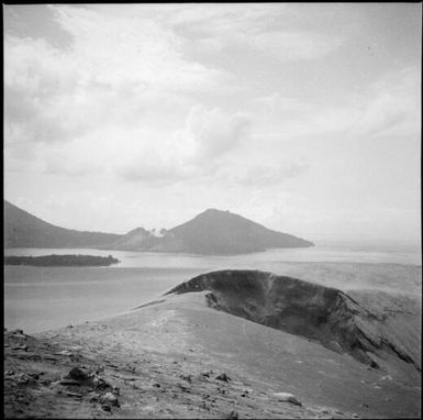 Crater coated pumice and ash with South Daughter Mountain on the opposite side of the harbour, Rabaul Harbour, New Guinea, 1937 / Sarah Chinnery