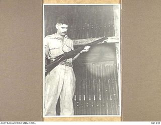 17 MILE, PORT MORESBY AREA, NEW GUINEA. 1943-12-13. SX14584 SERGEANT R. T. MATTISON OF THE AUSTRALIAN ELECTRICAL AND MECHANICAL ENGINEERS, NON COMMISSIONED OFFICER-IN-CHARGE OF A SECTION OF ..