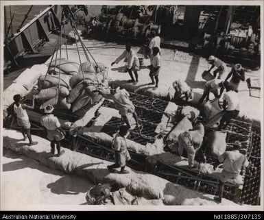 Loading sugar bags onto ships