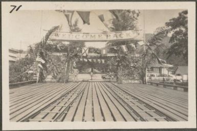 Pier at wharf decorated in honour of the return of the Governor's return from holiday, Rabaul, New Britain Island, Papua New Guinea, approximately 1916