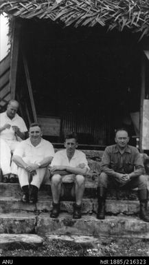 Group at steps of Government House in Madang. From left: Earl, Herring, Jenks (NZ), Dibble (NZ)