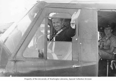Senator Henry M. Jackson waving from a helicopter near Pacific Command headquarters, Hawaii, December 1962