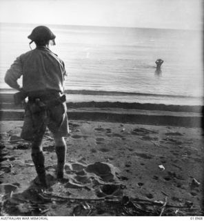 WHEN THE FIRST LINE OF AUSTRALIAN INFANTRY PASSED OVER THEIR POSITIONS FOUR JAPANESE RACED INTO THE WATER. CALLED ON TO SURRENDER, THREE OF THEM STARTED TO SWIM OUT TO SEA AND WERE SHOT. THE FOURTH ..