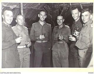 TOKO, BOUGAINVILLE. 1945-08-28. STAFF OFFICERS OF HEADQUARTERS 3 DIVISION AT THE DINNER HELD TO CELEBRATE VICTORY OVER JAPAN. THE DINNER WAS ATTENDED BY MAJOR GENERAL W. BRIDGEFORD, GENERAL OFFICER ..