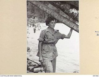 LAE, NEW GUINEA, 1945-05-18. SIGNALWOMAN D. CALAM, AUSTRALIAN WOMEN'S ARMY SERVICE BARRACKS, ON THE BANKS OF THE BUSU RIVER DURING A TOUR OF THE AREA CONDUCTED BY ARMY AMENITIES SERVICE FOR ..