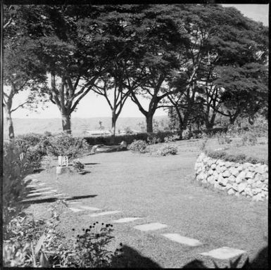 View to the harbour across Chinnery's front yard with buildings in the middle distance, Malaguna Road, Rabaul, New Guinea, ca. 1936 / Sarah Chinnery