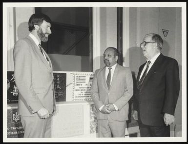 Delegates standing near the International Wall of Friendship, approximately 1972 / John McKinnon