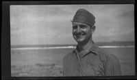 [Serviceman Earl Wilder on beach]