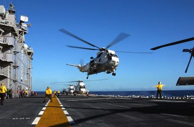 A US Navy (USN) UH-3H Sea King helicopter, Helicopter Combat Support Squadron 85 (HC-85), Golden Gators, Naval Air Station North Island (NASNI), California (CA), takes off from the flightdeck of the USN Tarawa Class Amphibious Assault Ship USS TARAWA (LHA 1). The TARAWA is participating in Rim of the Pacific (RIMPAC) 2004. RIMPAC is the largest international maritime exercise in the waters around the Hawaiian Islands. This years exercise includes seven participating nations: Australia, Canada, Chile, Japan, South Korea, the United Kingdom and the United States. RIMPAC enhances the tactical proficiency of participating units in a wide array of combined operations at sea, while enhancing...