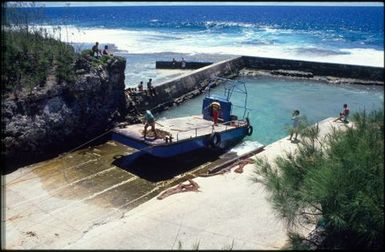 Concrete jetty and barge