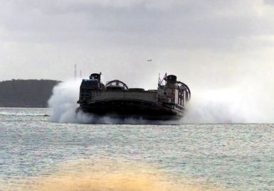 Landing Craft Air Cushioned (LCAC) 57 approaches Inner Apra Harbor, Guam in support of Exercise TANDEM THRUST 2003