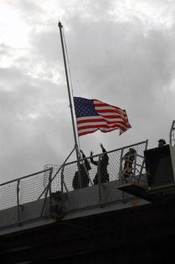 U.S. Navy Sailors on board the Whidbey Island Class Dock Landing Ship USS ASHLAND (LSD 48) secure the ensign before getting underway from Naval Amphibious Base Little Creek on November 16, 2006. The ASHLAND will relieve Tarawa Class Amphibious Assault Ship USS SAIPAN (LHA 2) in the 5th Fleet area of responsibility. (U.S. Navy photo by Mass Communication SPECIALIST SEAMAN John Suits) (Released)