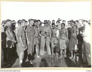 Rescued after living ten and 14 months respectively with natives in New Britain, three American aviators and an Australian were welcomed at a New Guinea base. Left to right (marked with crosses) ..