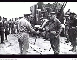 TOROKINA. 1945-09-08. LIEUTENANT GENERAL (LT GEN) S. G. SAVIGE, GENERAL OFFICER COMMANDING 2 CORPS, ACCEPTED THE SURRENDER OF ALL JAPANESE FORCES ON BOUGAINVILLE FROM LT GEN M. KANDA, COMMANDER ..