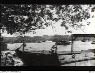 ORO BAY, NEW GUINEA. 1943-07-21. A SECTION OF THE BAY WHICH WAS BEING USED AS A SUPPLY BASE FOR TROOPS TO THE NORTH. SHOWN MISCELLANEOUS SMALL CRAFT USED IN TRANSHIPPING THESE SUPPLIES TO MOROBE