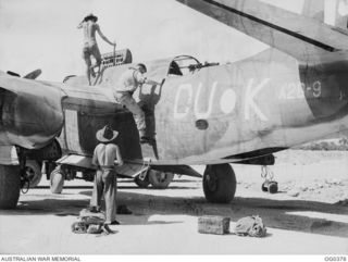 KIRIWINA, TROBRIAND ISLANDS, PAPUA. C. 1943-12. WING COMMANDER J. G. EMERTON OF HAWTHORN, VIC, COMMANDING OFFICER OF NO. 22 (BOSTON) SQUADRON RAAF, WHO HAS MADE NEARLY A SCORE OF STRIKES IN BOSTON ..