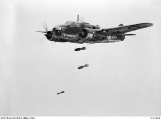 WEWAK AREA, NORTH NEW GUINEA. 1945-01-19. THREE 250-POUNDERS ARE SEEN LEAVING THE BOMB BAY OF BEAUFORT BOMBER AIRCRAFT IN FLIGHT, CODE QH, SERIAL NO. A9-427, OF NO. 100 SQUADRON RAAF. BEAUFORT ..