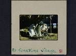 Woman preparing food over firewood and Kathleen Vellacott-Jones, Tureture village