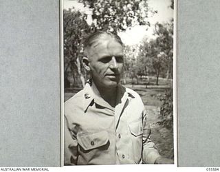PORT MORESBY, NEW GUINEA, 1943-08-12. CAPTAIN J. T. QUINN, AIR SUPPORT LIAISON OFFICER, UNITED STATES ARMY, AT HEADQUARTERS, NEW GUINEA FORCE