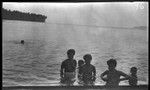 Group of children and adults inside beach