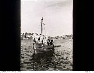 Astrolabe Bay, New Guinea, 1944-12. RAAF General Purpose Launch no. 015-70 of No. 111 Air Sea Rescue Flight RAAF returning to Madang from a trip to Karkar Island. Aboard the boat is a group of ..