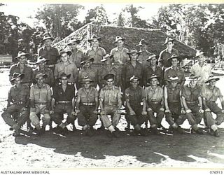 LAE, AREA, NEW GUINEA. 1944-11-18. PERSONNEL OF NO.1 PLATOON, GENERAL ENGINEERING COMPANY, 2/7TH ADVANCED WORKSHOPS, COMPANY COMMANDER, NX200523 LIEUTENANT R.A. ROGERS, WARRANT OFFICER IN CHARGE, ..