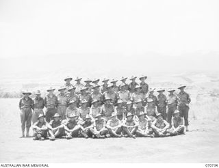 DALLMAN RIVER, NEW GUINEA 1944-02-23. THE COMMANDING OFFICER WITH OFFICERS OF THE 2/14TH FIELD REGIMENT. IDENTIFIED PERSONNEL ARE: SX10841 LIEUTENANT (LT) L.K. BROMLEY (1); NX3222 LT J.A. CALLINAN ..
