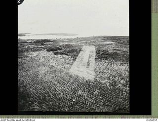 Aerial view of a wartime airstrip located on the northern coast of New Guinea