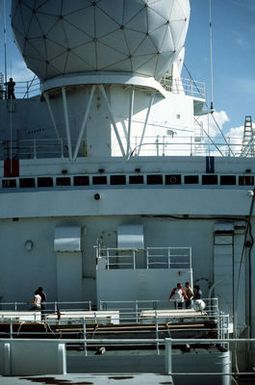 An amidships view of the missile range instrumentation ship USNS OBSERVATION ISLAND (T-AGM 23) showing one of the ship's two radar spheres
