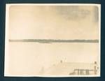 View of Government yacht Franklin at sea, from Government store bridge, Noussa [Nusa?] island in background, New Guinea, c1929 to 1931