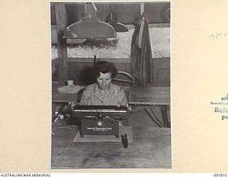 LAE, NEW GUINEA. 1945-05-15. PRIVATE N.V. LAWRENCE, TYPIST AT INTELLIGENCE, HEADQUARTERS FIRST ARMY. A FEW DAYS AFTER THEIR ARRIVAL FROM AUSTRALIA AUSTRALIAN WOMEN'S ARMY SERVICE PERSONNEL ALLOTTED ..