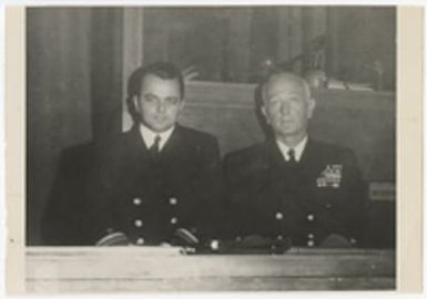 [Rear Admiral Arthur G. Robinson and Lieutenant Edward Fields seated in courtroom]