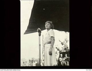 TADJI NEAR AITAPE, NORTH EAST NEW GUINEA. C. 1944-10. JUDITH ANDERSON SINGING ON STAGE AT A CONCERT AT A FORWARD AREA FOR PERSONNEL OF NOS. 8 AND 100 (BEAUFORT) SQUADRON RAAF