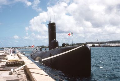 Starboard view of the Japanese submarine ARASHIO (SS 565) moored in Apra Harbor