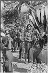 Pig festival, singsing, Kwiop: decorated men with feather headdresses and cordyline bundles