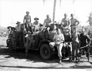 AITAPE, NORTH EAST NEW GUINEA. 1944-05-02. RAAF AIRMEN SEATED AND STANDING ON A CAPTURED JAPANESE PETROL TANKER WHICH IS USED FOR REFUELLING ALLIED AIRCRAFT ON THE RAAF BUILT AIRSTRIP AT TADJI