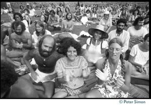 Audience members seated on the lawn to hear Ram Dass at Andrews Amphitheater, University of Hawaii