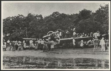 Smithy's [i.e. Sir Charles Kingsford Smith's] Lockheed Altair, Lady Southern Cross, being refuelled on Naselai Beach, Fiji, during Australia-U.S.A. flight, 1934