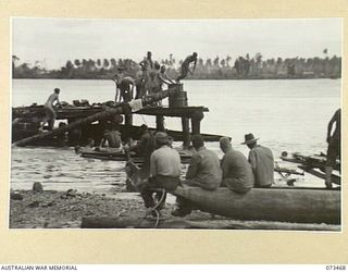 ALEXISHAFEN, NEW GUINEA. 1944-05-23. TROOPS OF THE 8TH INFANTRY BRIGADE SWIMMING AND DIVING FROM THE OLD JETTY