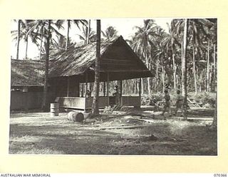 MILNE BAY, NEW GUINEA. 1944-02-10. N387662 LIEUTENANT V. W. MAXWELL (1) THE OFFICER-IN-CHARGE OF THE PRODUCTION CONTROL BOARD PLANTATION IN THE AREA, WITH NGX281 WARRANT OFFICER (WO) 2 K. M. ..