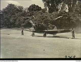 TOROKINA, BOUGAINVILLE ISLAND, SOLOMON ISLANDS. C. 1945-08. TAXIING OUT BEFORE TAKING OFF FROM A BOUGAINVILLE JUNGLE STRIP ON A TACTICAL RECONNAISSANCE SORTIE, 432800 FLYING OFFICER DOUG HILLIGER, ..