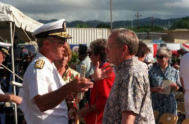 ADM Robert J. Kelly, Commander in CHIEF, U.S. Pacific Fleet, and H. Lawrence Garrett III, Secretary of the Navy chat during Survivors Day ceremonies at USS ARIZONA Memorial Visitors Center. The event honors the sailors and Marines of the battleships that were sunk or damaged in the Dec. 7, 1941, attack on Pearl Harbor