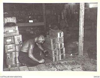 TOROKINA, BOUGAINVILLE. 1945-07-25. PRIVATE S. TAYLOR, 16 ADVANCED ORDNANCE DEPOT DISPATCHING WIRELESS STORES TO FORWARD AREAS