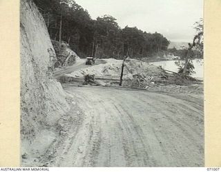 LAE - NADZAB ROAD, NEW GUINEA. 1944-03-09. THE BENCHING ON THE ROAD ALONGSIDE THE MARKHAM RIVER AT MARKHAM POINT 86 1/2 MILES FROM WAU